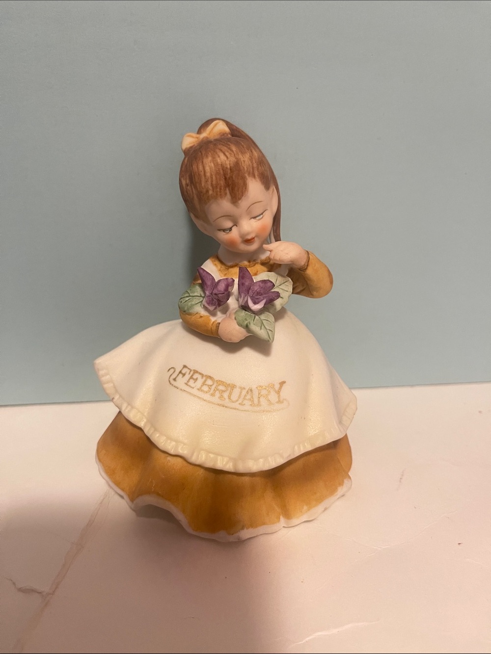 February Birthday Girl Figurine – White and Brown Decorative Collectible